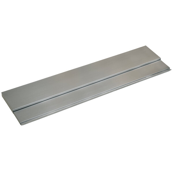 A silver metal cover with two long strips on a metal box.