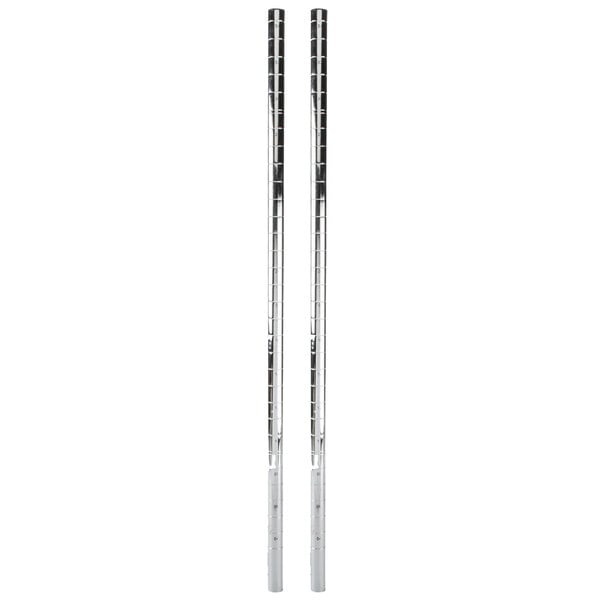 A pair of silver metal poles with white ends.
