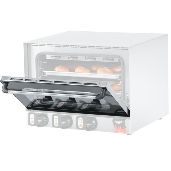 The door of a Vollrath convection oven with food inside.