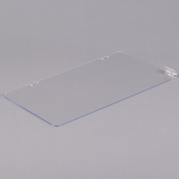 A clear plastic door for a Paragon popcorn popper on a white surface.