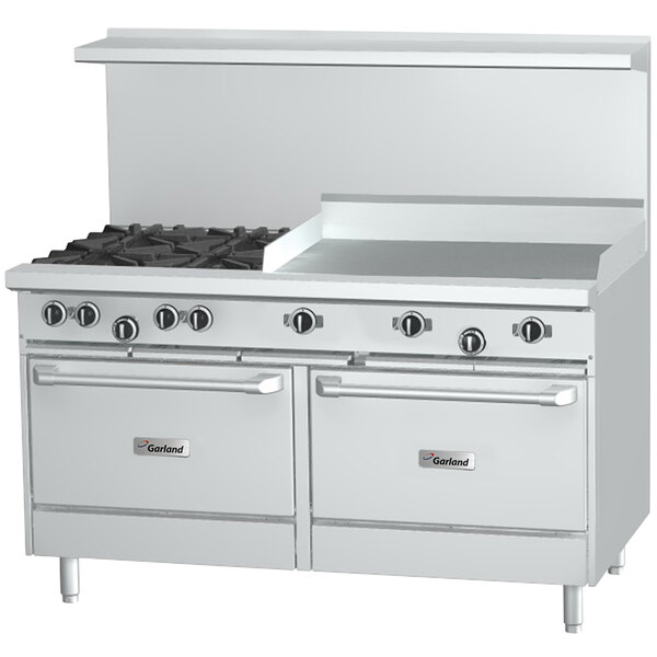 A stainless steel Garland range with two ovens and a griddle over two burners.