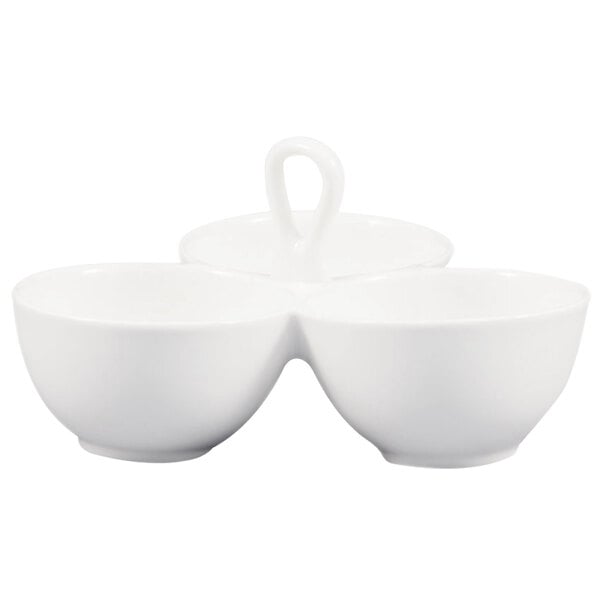A white CAC china bowl with three bowls and a handle.