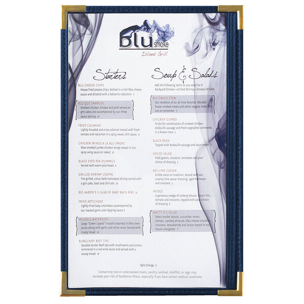 A blue Menu Solutions menu board with gold corners on a table.