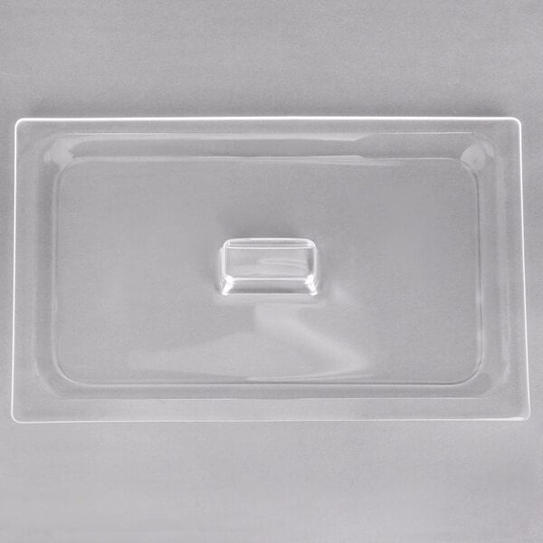 A clear plastic lid with a rectangle in the middle.