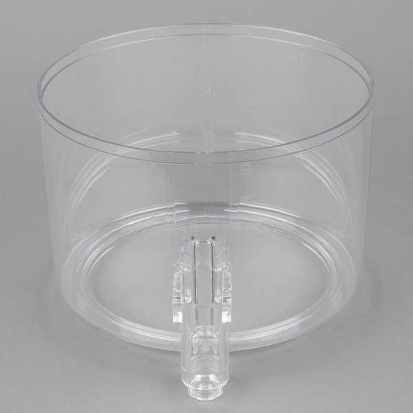 A clear plastic bowl with a handle.