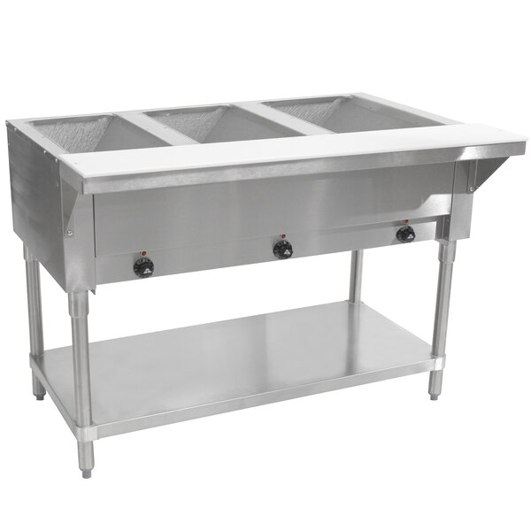 A stainless steel Advance Tabco hot food table with three sealed wells on a counter.
