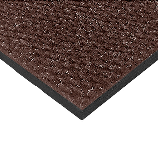 A brown Cactus Mat carpet mat with black trim.
