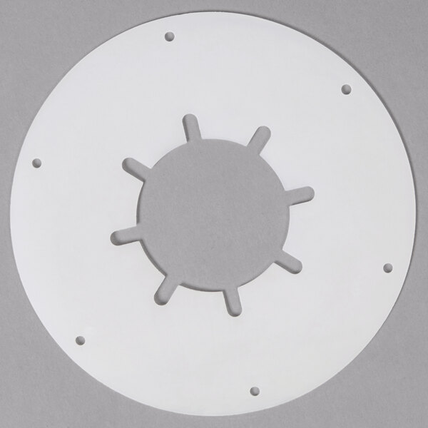 A white circular object with holes in it.
