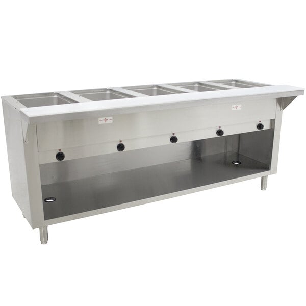 An Advance Tabco stainless steel electric hot food table with enclosed base holding five pans.