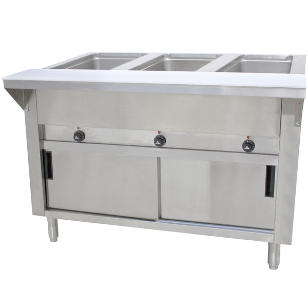 A stainless steel Advance Tabco hot food table with enclosed sliding doors.