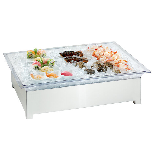 A Cal-Mil stainless steel ice housing system on a table with food on ice.