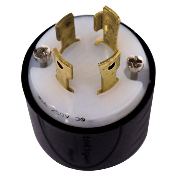 A round black and gold plug with gold metal connectors on a white background.
