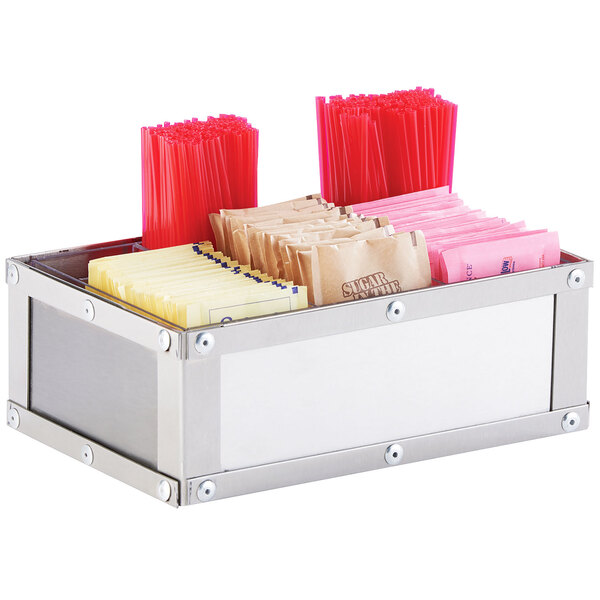 A silver metal Cal-Mil condiment organizer with condiments inside.