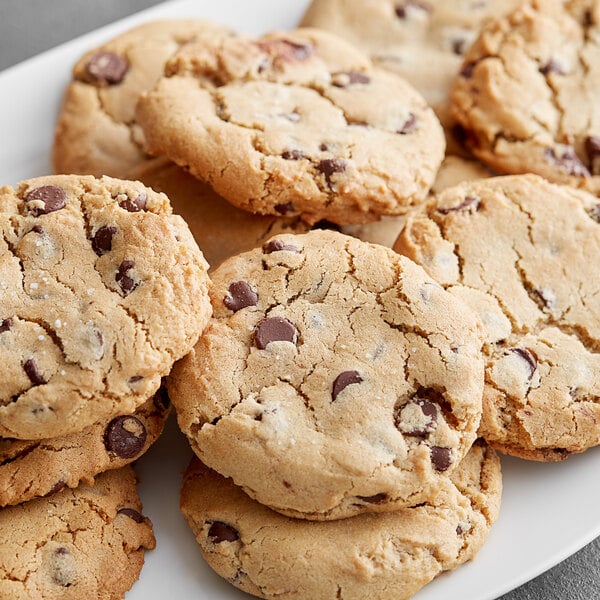 A plate of HERSHEY'S Special Dark chocolate chip cookies on a table.