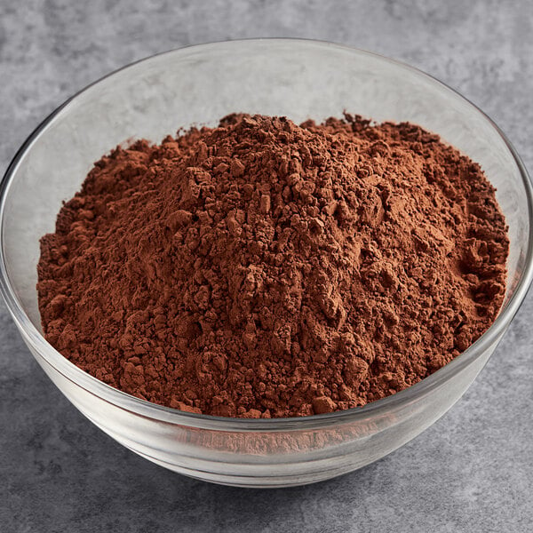 A bowl of HERSHEY'S Dutch cocoa powder on a table.