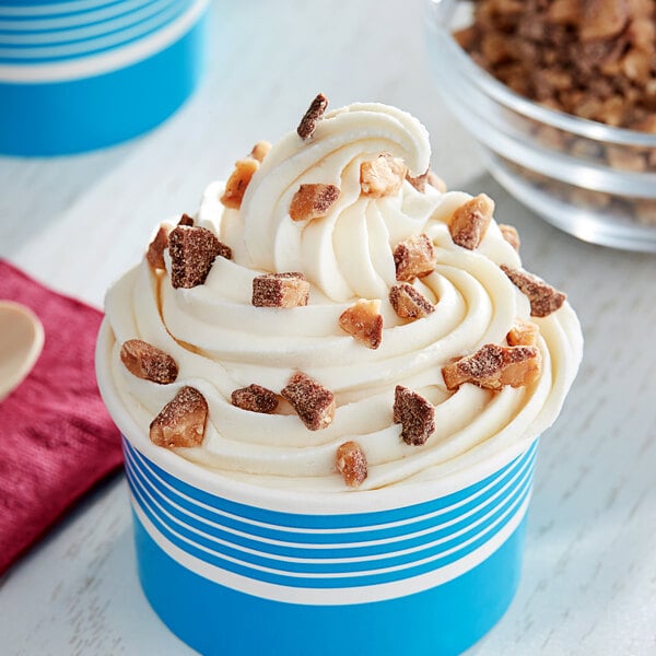 A cup of ice cream with HEATH toffee bits, chocolate chips, and nuts.