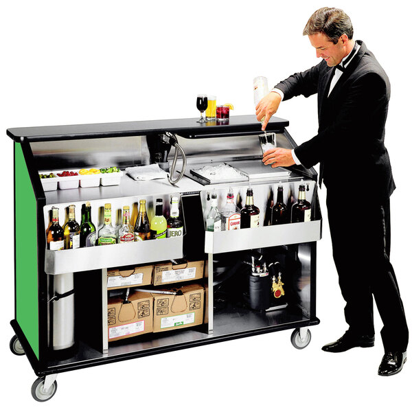 A man in a tuxedo pouring a drink from a Lakeside portable bar.