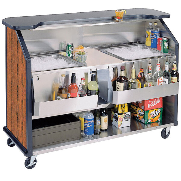 A Lakeside stainless steel portable bar with Victorian cherry laminate finish and ice bins filled with bottles and ice.
