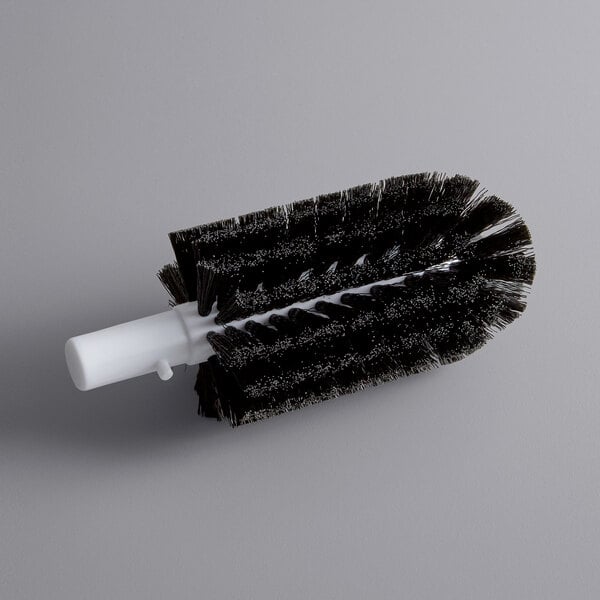A black and white circular brush with a black handle.