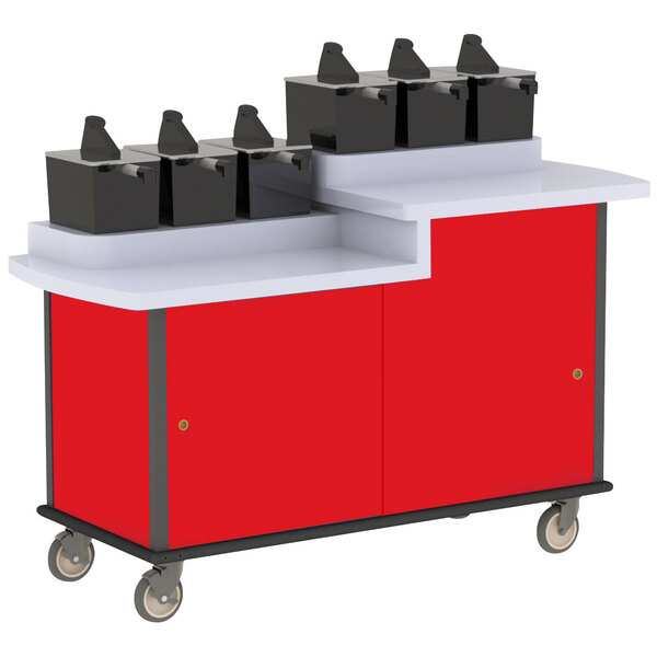 A red and white Lakeside condiment cart with black boxes on top.