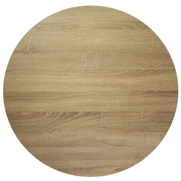 A BFM Seating Midtown circular wood table top with a Sawmill Oak finish.
