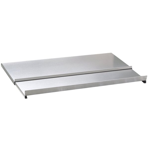 A stainless steel sliding ice bin cover on a metal counter.