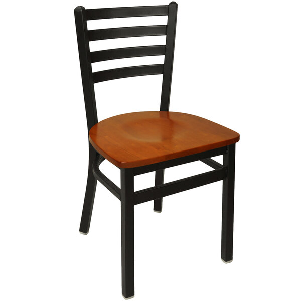 A BFM Seating Lima metal ladder back side chair with a cherry wooden seat.