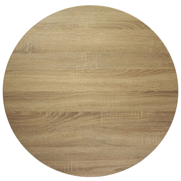 A BFM Seating Midtown round wood tabletop with a sawmill oak finish.