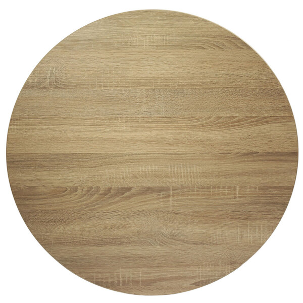 A BFM Seating Midtown round wooden table top with a sawmill oak finish.