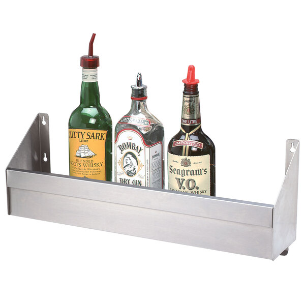 A stainless steel metal shelf holding bottles of liquor.