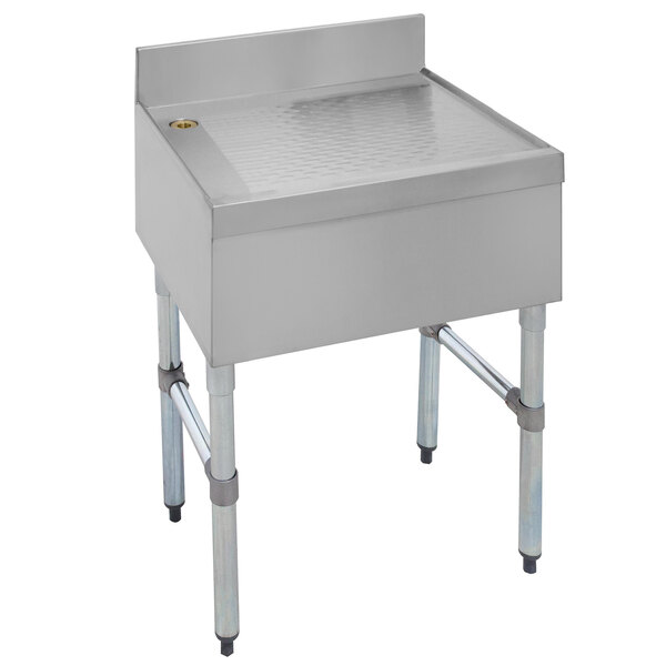 A stainless steel free-standing Advance Tabco bar drainboard with a drain.