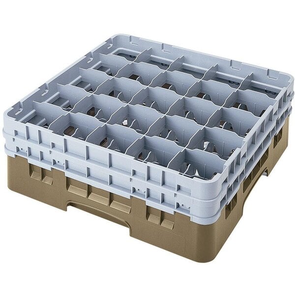 A beige plastic Cambro glass rack with 25 compartments and 3 extenders.