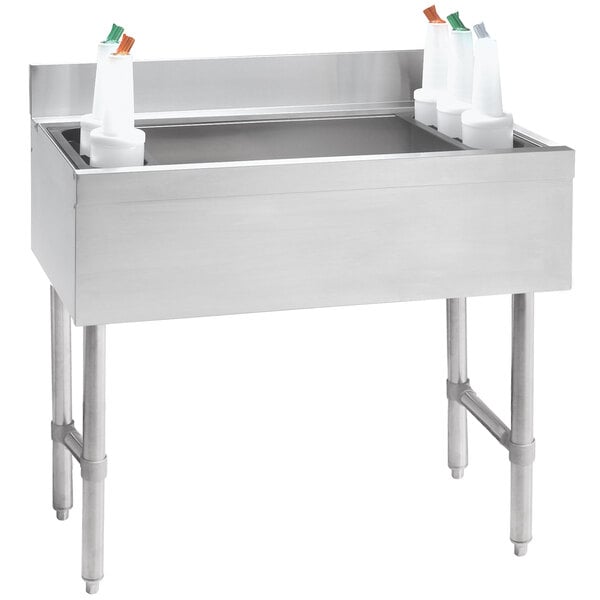 An Advance Tabco stainless steel underbar ice bin with a 7-circuit cold plate on a counter.