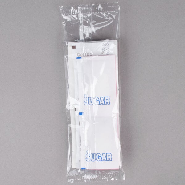 A clear plastic bag of Double Serving Hot Beverage Condiment Kits with white labels.