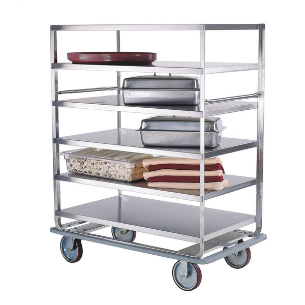 A stainless steel Lakeside banquet cart with food containers on it.