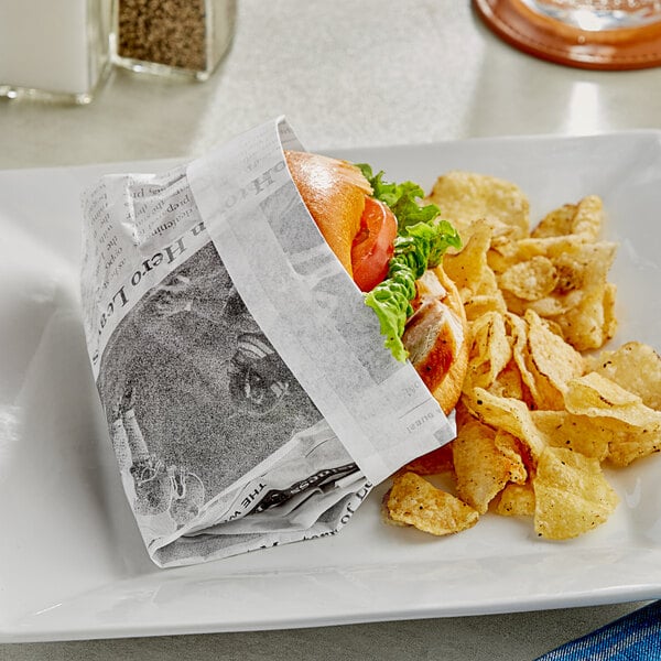 A sandwich and chips wrapped in Choice newspaper deli paper on a plate.
