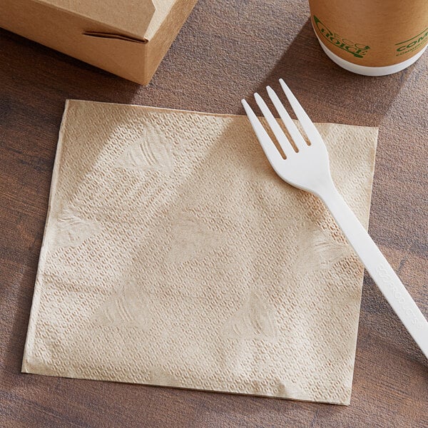 A 12" x 12" natural Kraft luncheon napkin with a plastic fork on it.