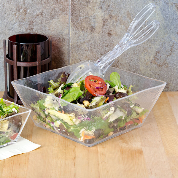 A salad in an American Metalcraft clear plastic square bowl.