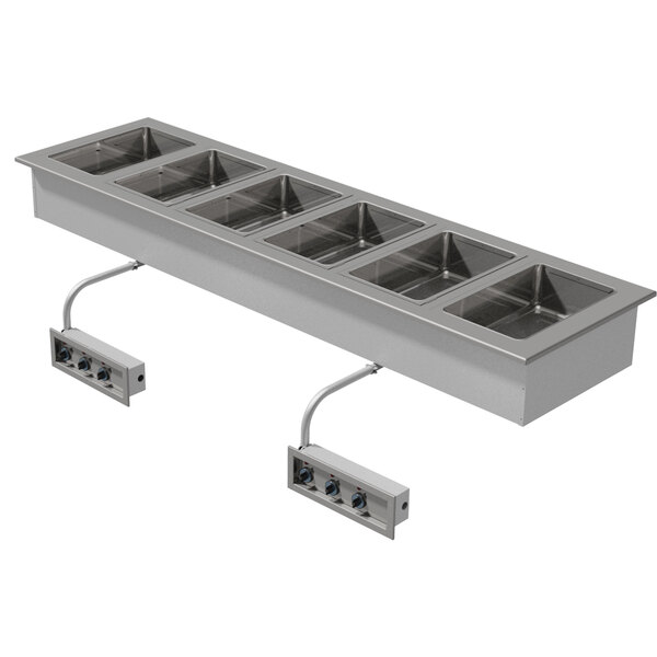 A silver rectangular Advance Tabco drop-in hot food well with six rectangular compartments.