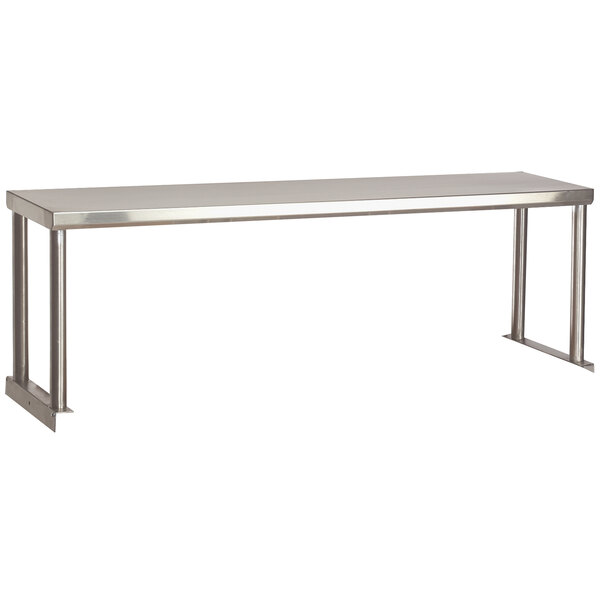 A stainless steel single overshelf on a long rectangular metal table.