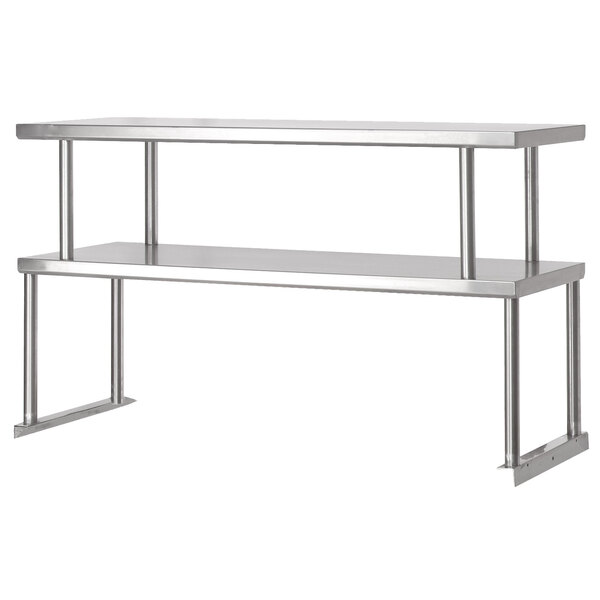 A stainless steel Advance Tabco double overshelf on a counter with metal legs holding two shelves.