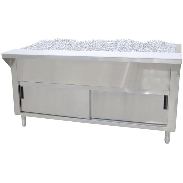An Advance Tabco stainless steel ice-cooled table with a cabinet and sliding doors filled with ice cubes.