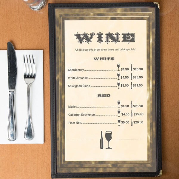 Brown menu paper with a marble border on a table with a knife and fork.