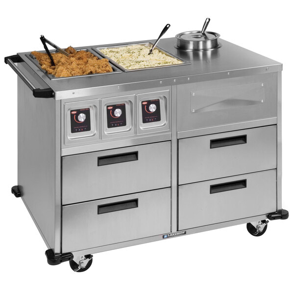 A Lakeside stainless steel mobile food station with two dry heat wells on a counter.