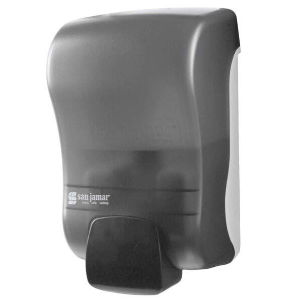 A grey San Jamar manual foam soap dispenser with a black plastic cover.