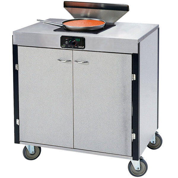 A Lakeside stainless steel cooking cart with a pan on top.