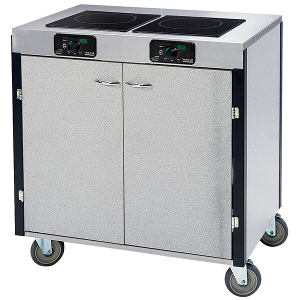 A Lakeside stainless steel mobile cooking cart with two induction burners.