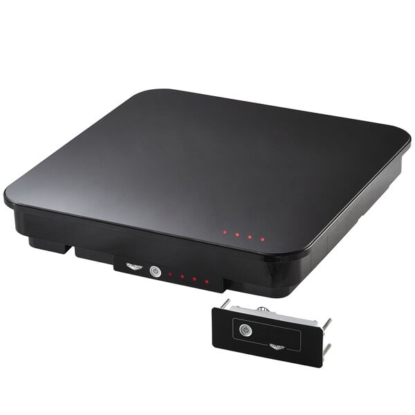 A black rectangular Vollrath Mirage Drop-In Induction Warmer with red lights on a kitchen counter.
