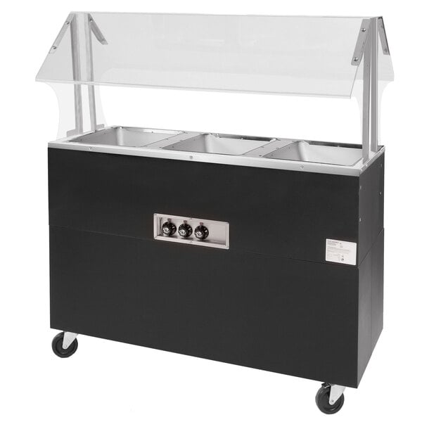 A black and silver food warmer on a counter with glass doors.