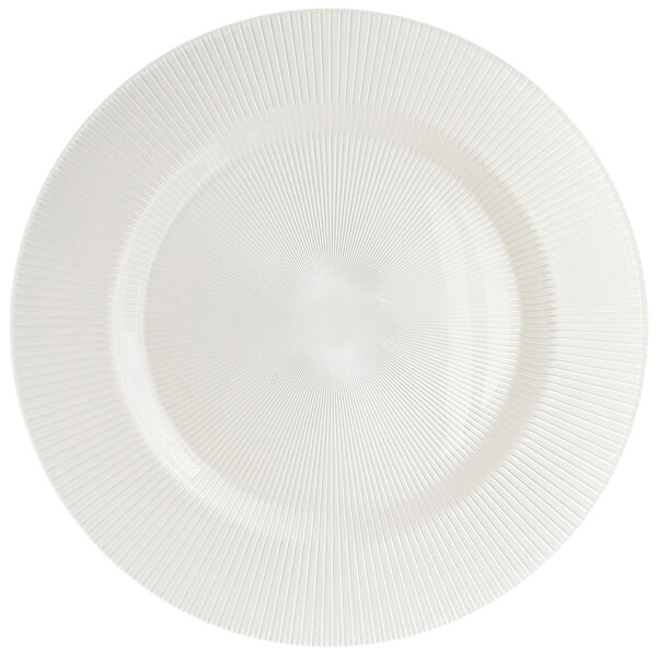 A white Charge It by Jay glass charger plate with a circular sunray pattern.